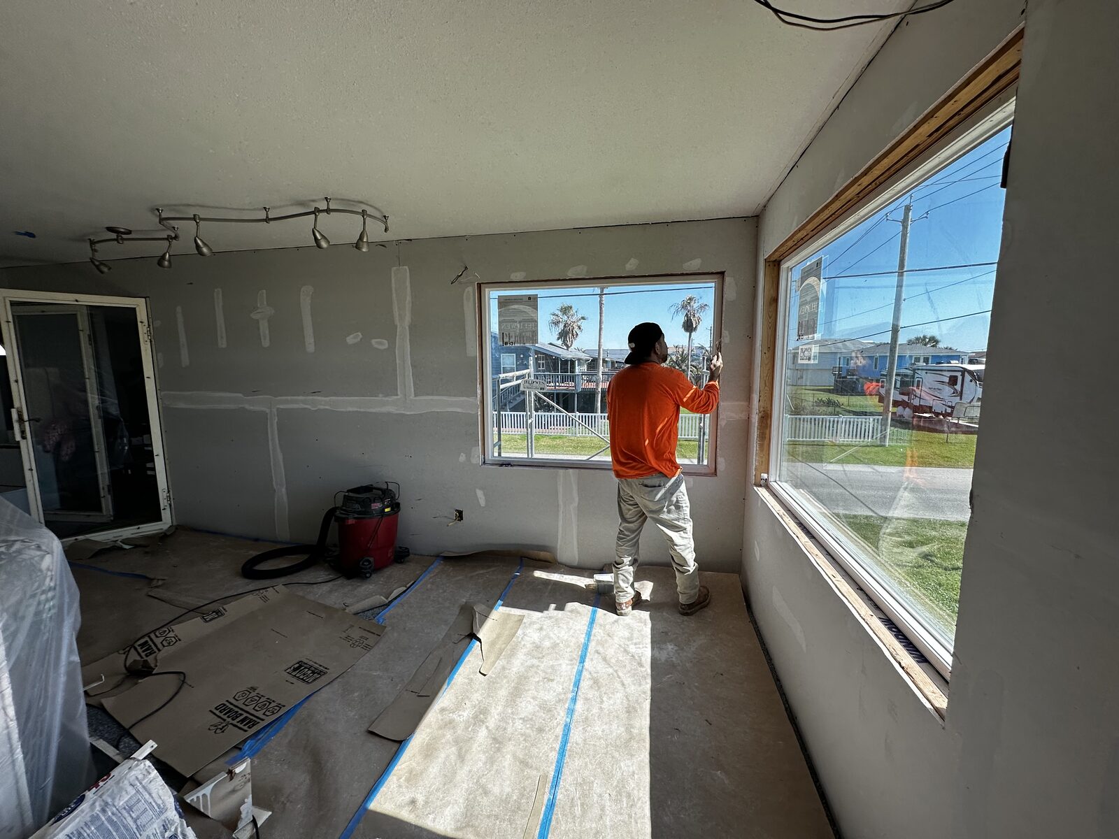 Interior drywall finishing during a gut renovation