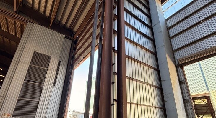 Structural steel I-beam columns on a commercial building