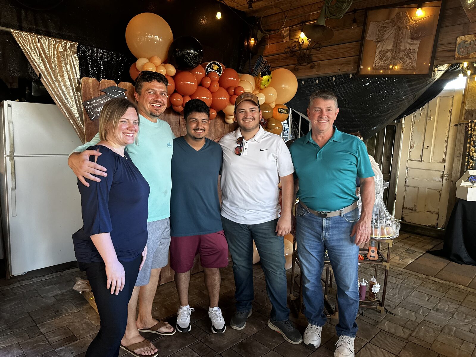 The Sand Star Services team, including Alex Cortez (center), an intern the company mentored into the skilled trades